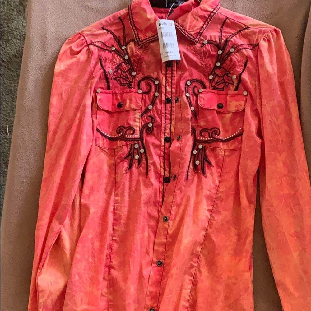 Coral colored western shirt.